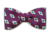Purple bow tie with green, white, blue, and red. Men's accessory.