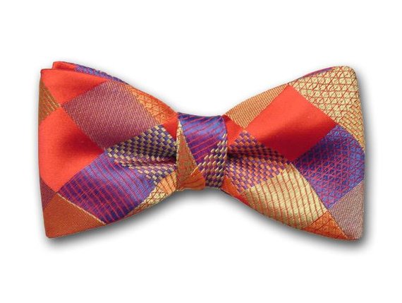 Luxurious men's bow tie. Red, gold, ochre and blue plaid bow tie.
