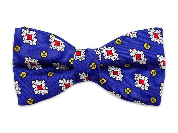 Royal blue bow tie. Small patterns white and red on blue. Self tie bow tie
