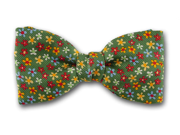 Smal lflower on green. Bow tie for baby, boy and youth.