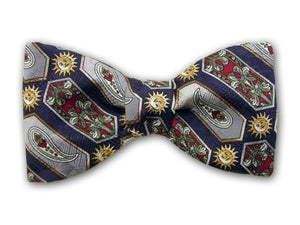 Sun, flowers, paisley, and geometric on navy. Silk jacquard bow tie.