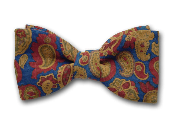 Brown, ochre, and green paisley on blue. Blue silk bow tie. Paisley bow ties.