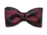 Navy blue geometric patterns on burgundy. Fine silk men's bow tie.