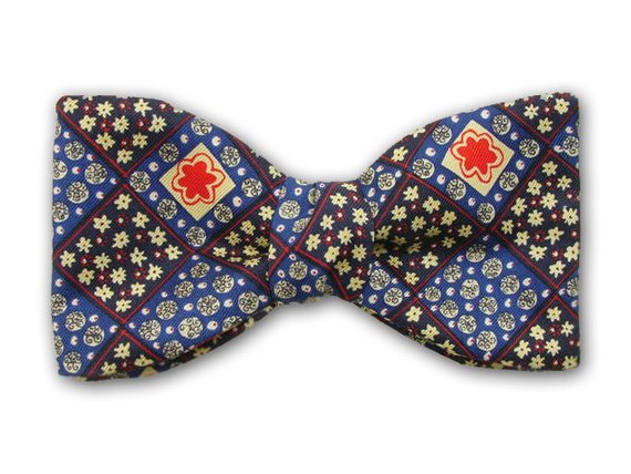Plaid pure silk bow tie with navy, blue, yellow and red squares.