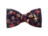 Beautiful Bow tie with Christmas ornaments. Red, gold, green and beige on black.