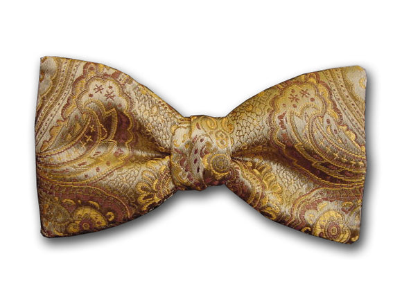 Gold paisley bow tie in different styles and widths made of woven silk.