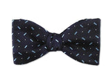 Navy blue bow tie. Small blue patterns on navy. 