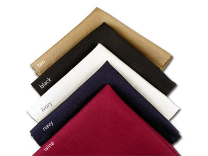 Solid tan, black, ivory, navy blue, and wine silk pocket squares. 
