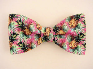 Hawaiian bow tie for men. Gold pineapple on pink.